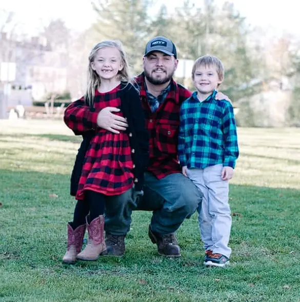 DJ, owner-operator of Ridge Cut Land Services, with his two kids